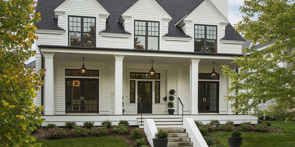Home with Benjamin Moore White Dove exterior paint color.  White home with black trim, doors and windows.