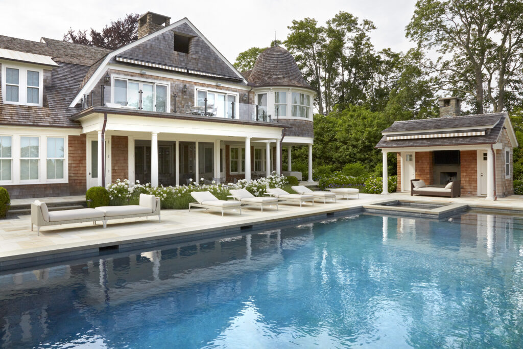 Hamptons-style pool with Iceberg roses in landscape design by Ed Hollander
