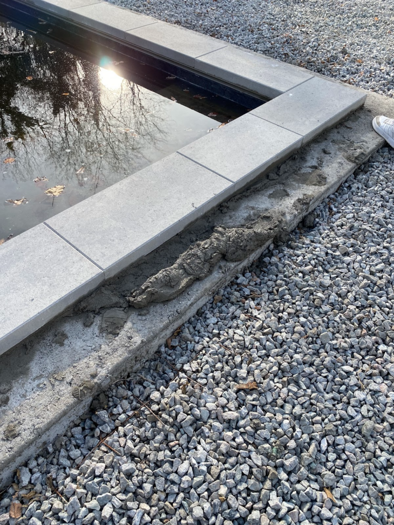 Techo-Bloc coping Raffinato stone in greyed nickel to achieve the Hamptons Style Pool vibe